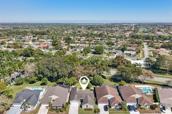 an aerial view of residential houses with city view