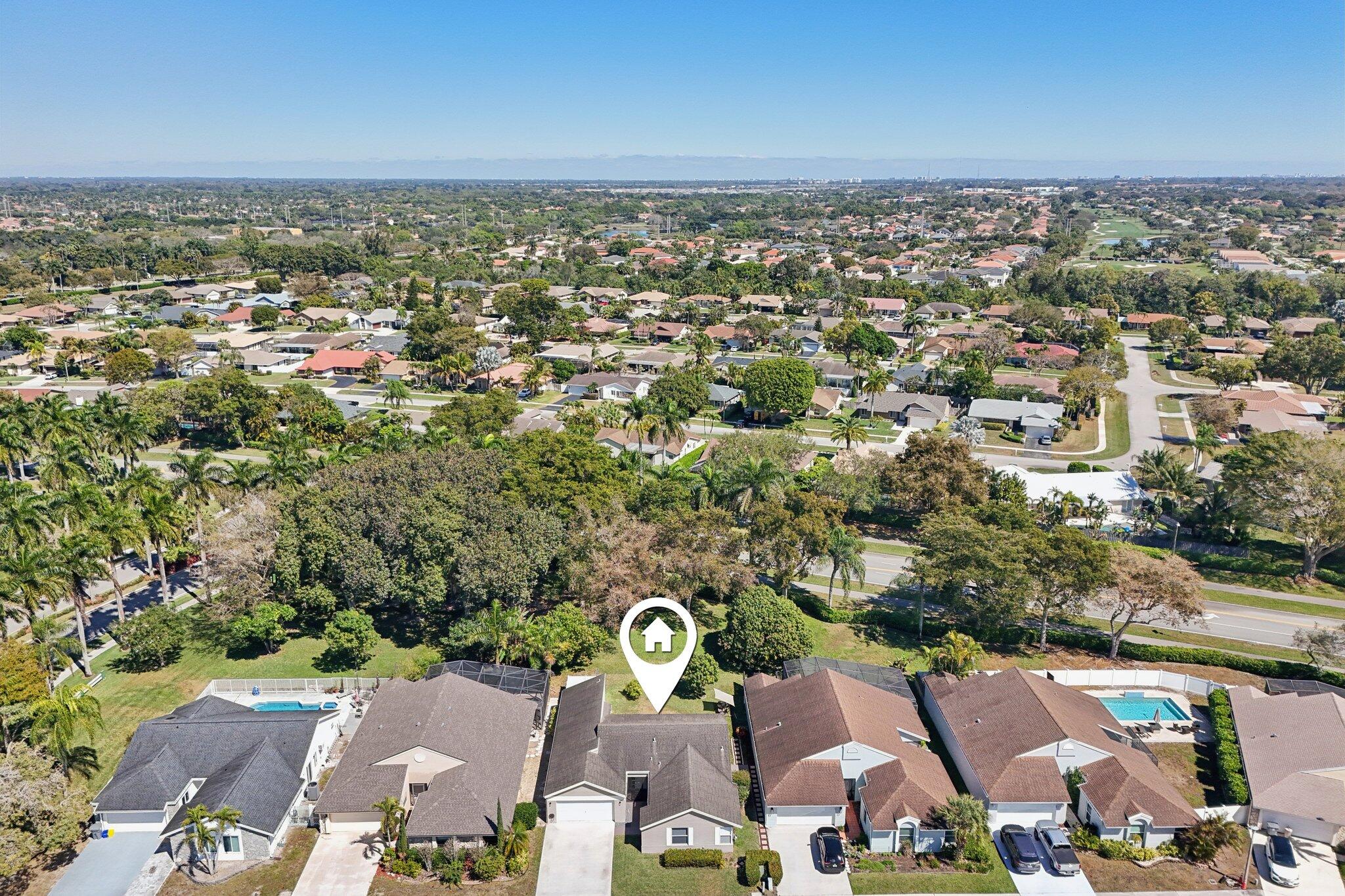 21024 Country Creek Drive Boca Raton, FL 33428 - Photo 45 of 59 an aerial view of a city with lots of residential buildings