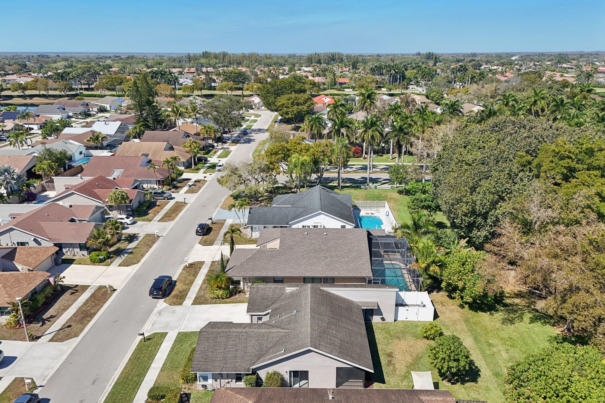 21024 Country Creek Drive Boca Raton, FL 33428 - Photo 47 of 59 an aerial view of residential houses with outdoor space and parking