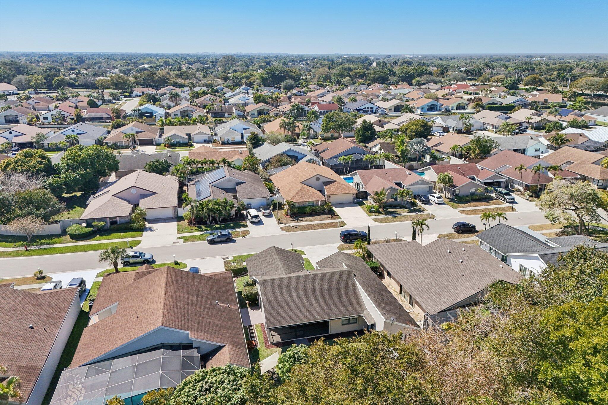 21024 Country Creek Drive Boca Raton, FL 33428 - Photo 48 of 59 an aerial view of a houses with a yard