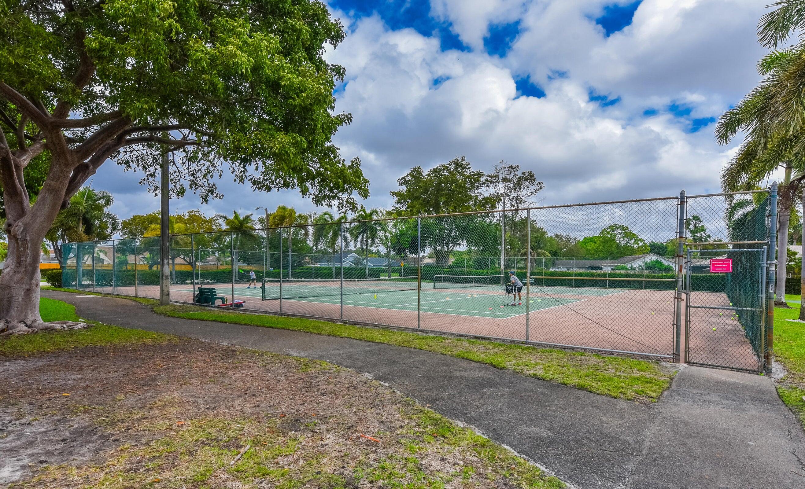 21024 Country Creek Drive Boca Raton, FL 33428 - Photo 57 of 59 a view of a park with swings and slides