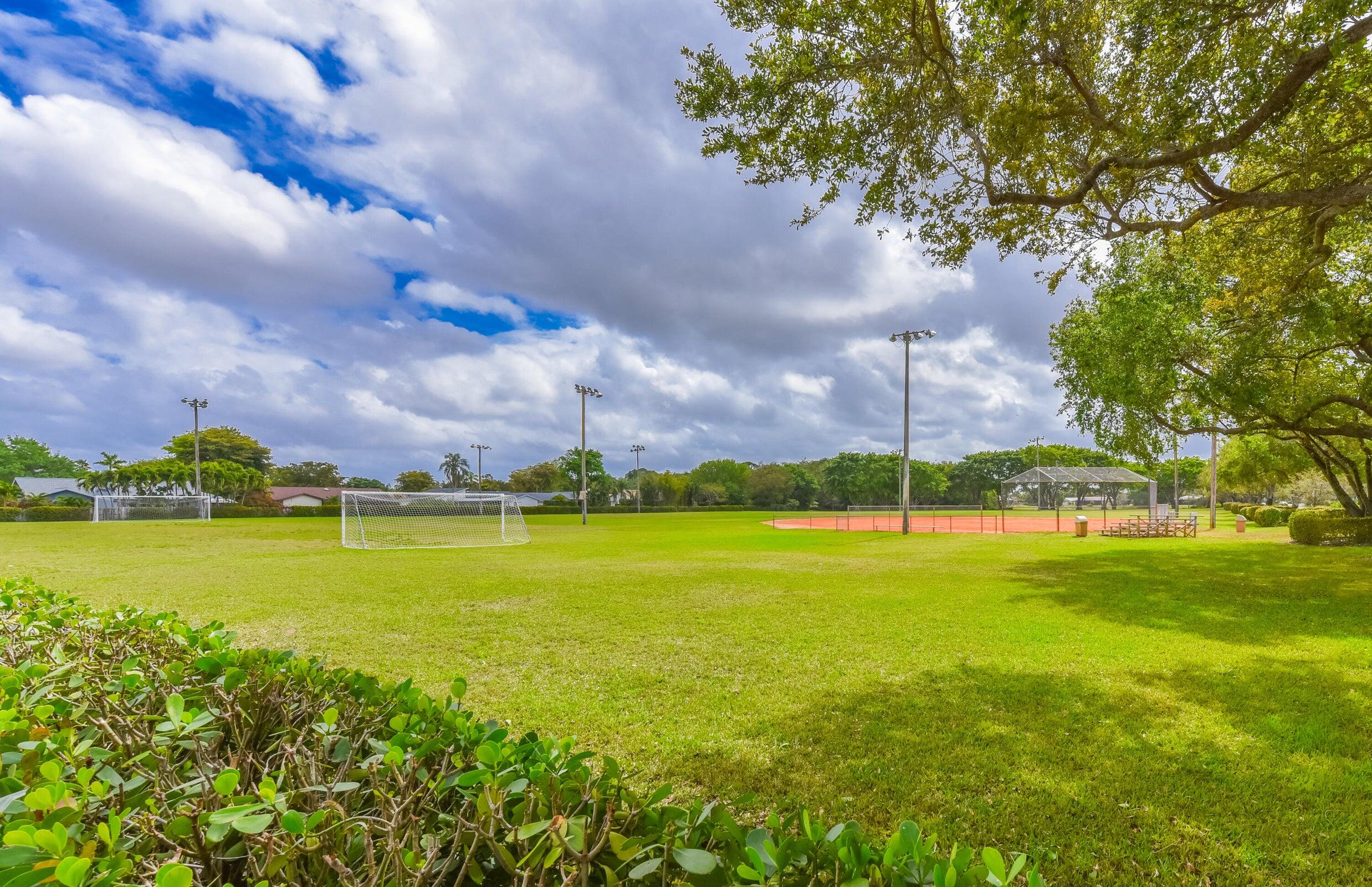 21024 Country Creek Drive Boca Raton, FL 33428 - Photo 58 of 59 a view of an ocean and a yard