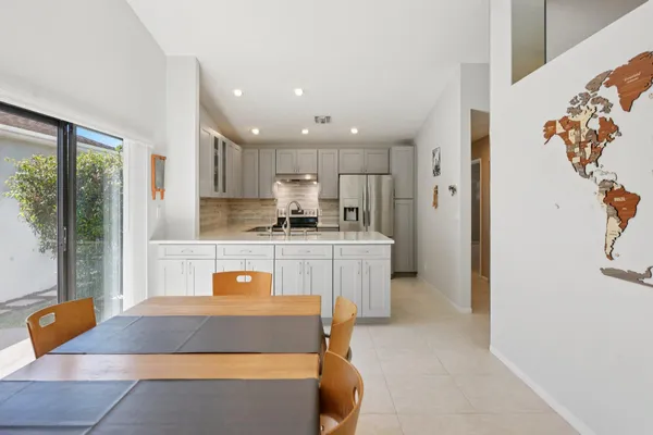 a view of a livingroom with furniture and a flat screen tv