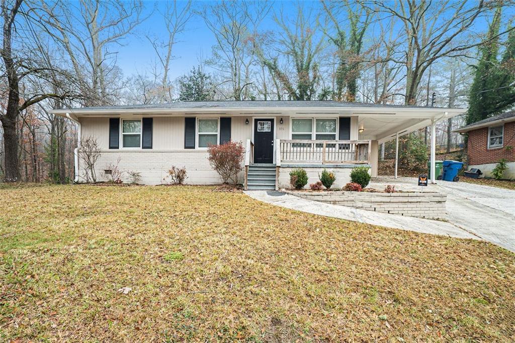 876 Hutchens Road Southeast Atlanta, GA 30354 - Photo 1 of 1 a front view of a house with a yard