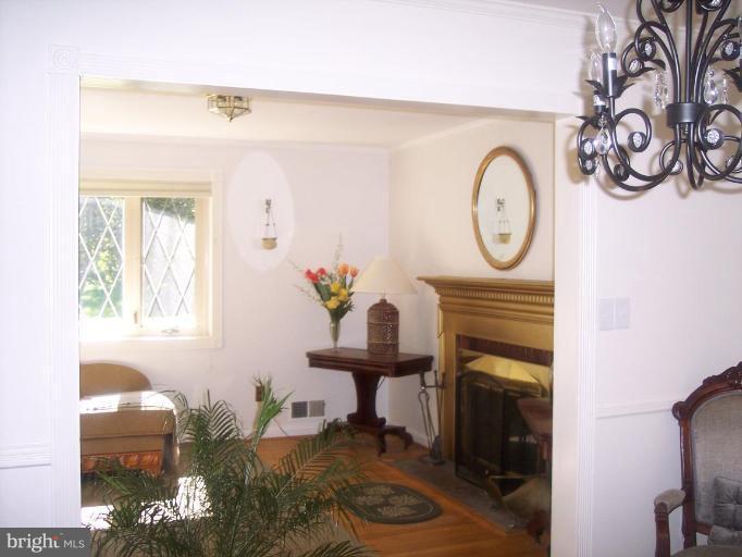 6209 Redwing Road Bethesda, MD 20817 - Photo 13 of 25 a living room with furniture and a fireplace