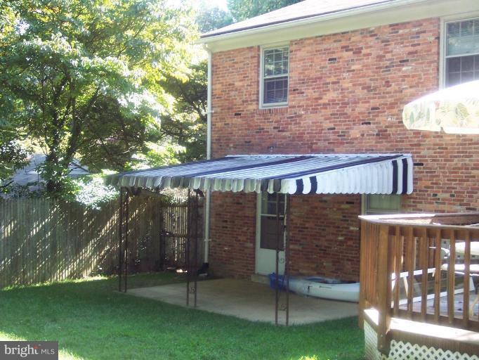 6209 Redwing Road Bethesda, MD 20817 - Photo 17 of 25 a front view of a house with a yard