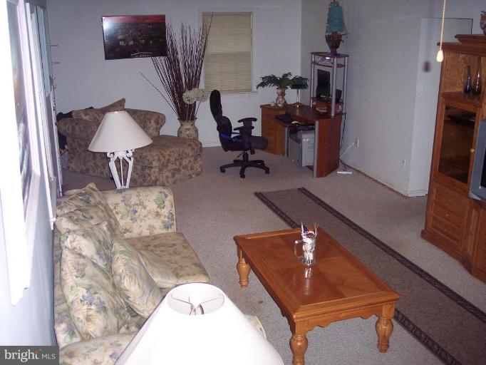 6209 Redwing Road Bethesda, MD 20817 - Photo 3 of 25 a living room with furniture and a couch