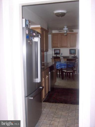 6209 Redwing Road Bethesda, MD 20817 - Photo 25 of 25 a kitchen with refrigerator and cabinets
