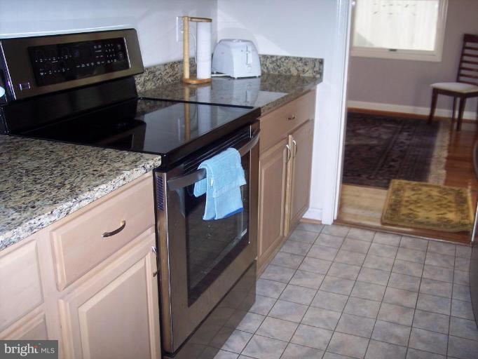 6209 Redwing Road Bethesda, MD 20817 - Photo 6 of 25 a kitchen with a sink and cabinets
