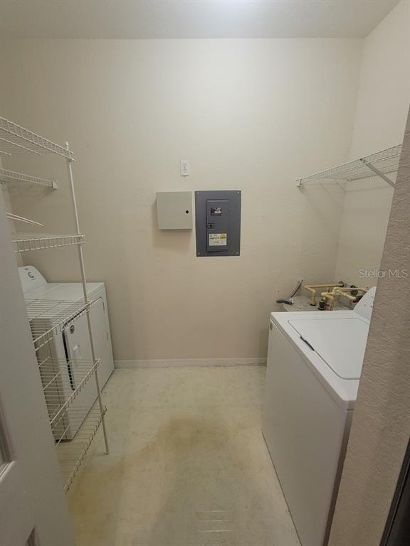 5709 Legacy Crescent Place, Unit 103 Riverview, FL 33578 - Photo 14 of 22 a utility room with dryer and washer