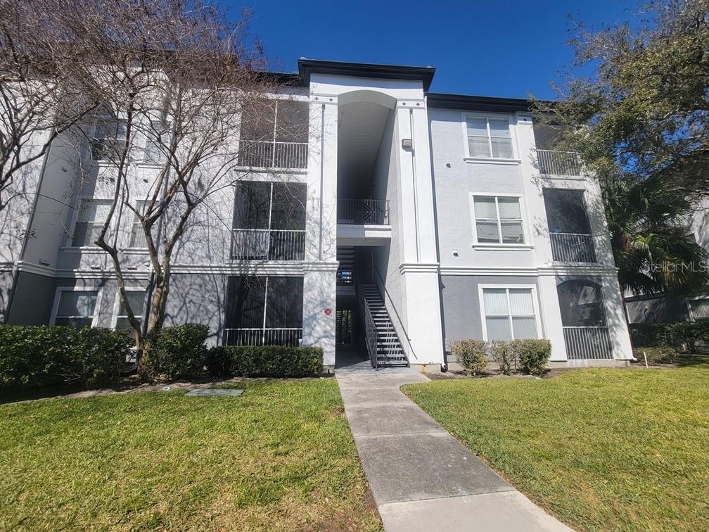 5709 Legacy Crescent Place, Unit 103 Riverview, FL 33578 - Photo 21 of 22 front view of a house with a yard