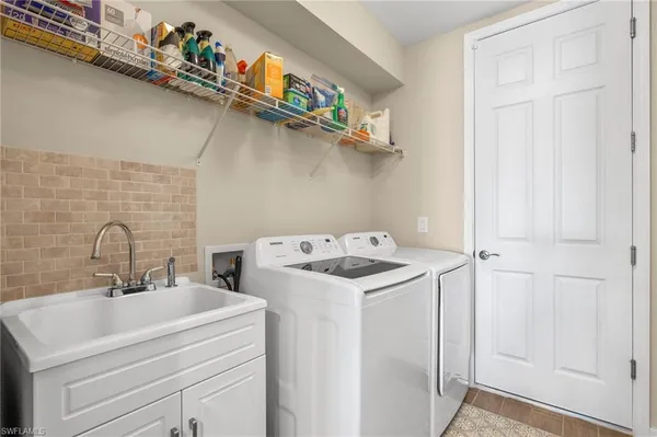 a utility room with dryer and washer