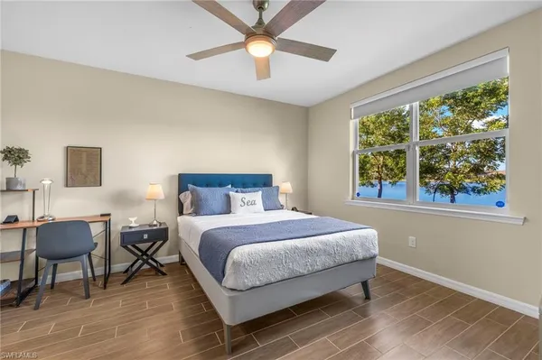 a bedroom with a bed and a table