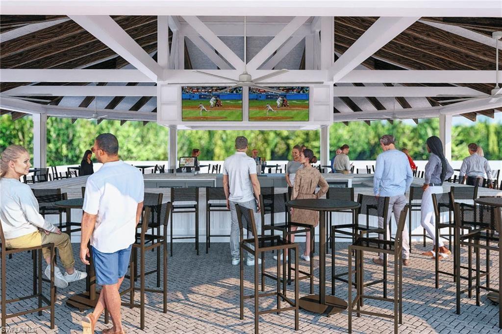 14644 Edgewater Circle Naples, FL 34114 - Photo 27 of 37 a view of an outside dining space with furniture