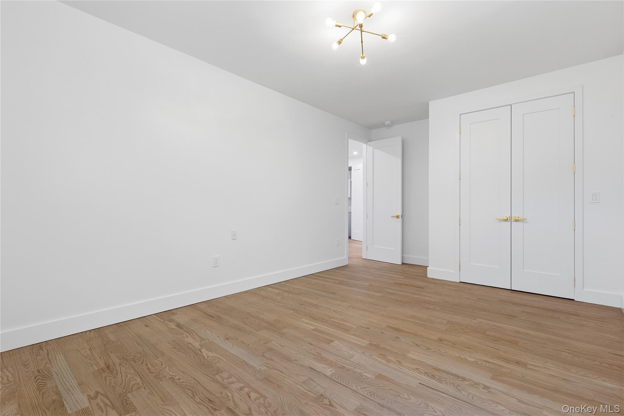548 Lakes Road Monroe, NY 10950 - Photo 37 of 50 a view of an empty room with wooden floor