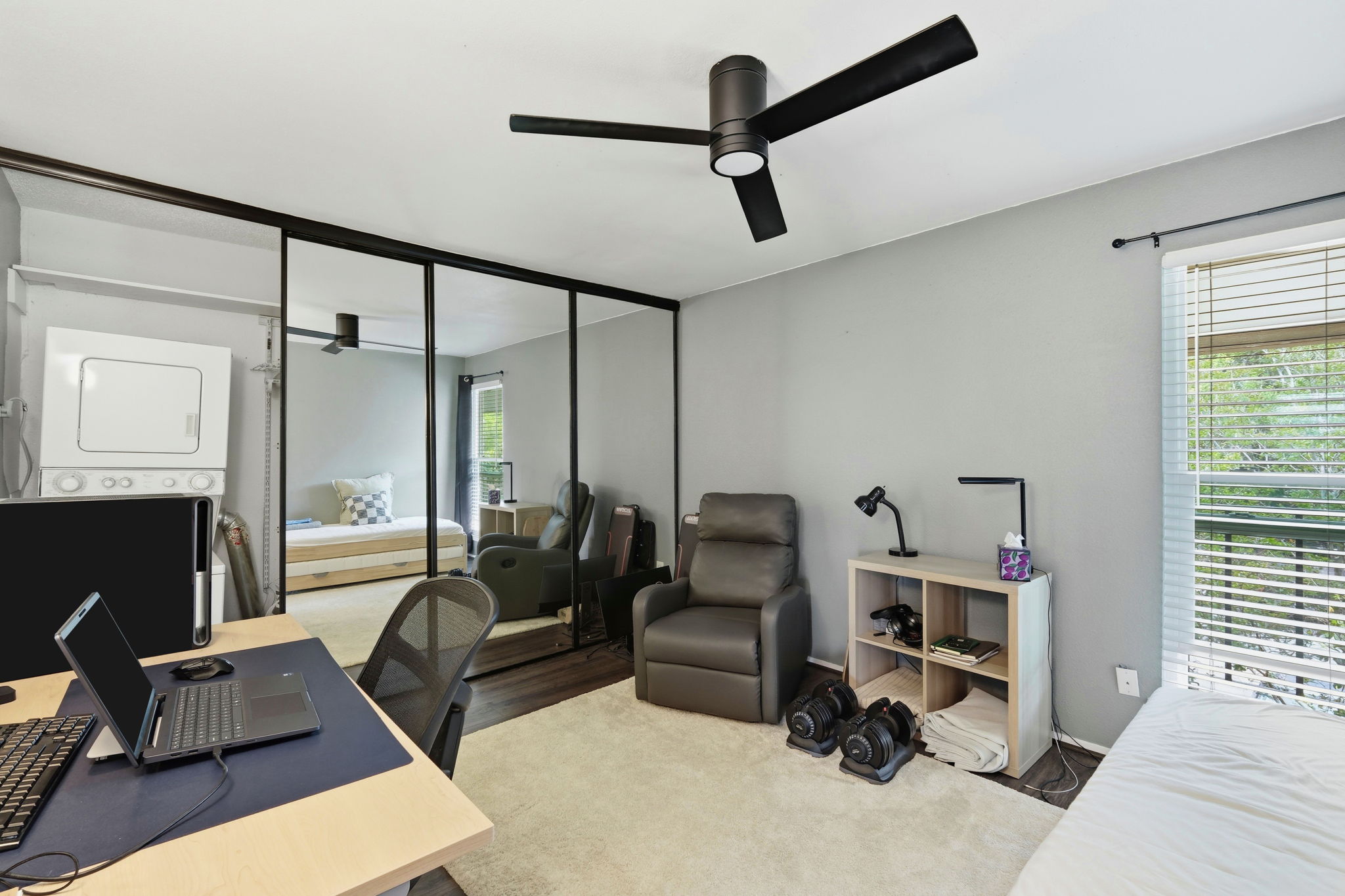 6910 Hart Lane, Unit 912 Austin, TX 78731 - Photo 18 of 36 Room featuring a flush-mount ceiling fan, light gray wall tones, and a window with horizontal blinds