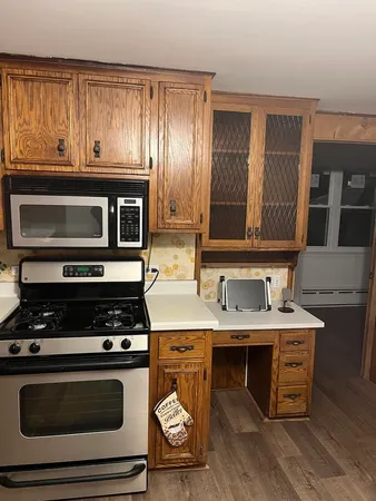 a kitchen with a stove and a microwave