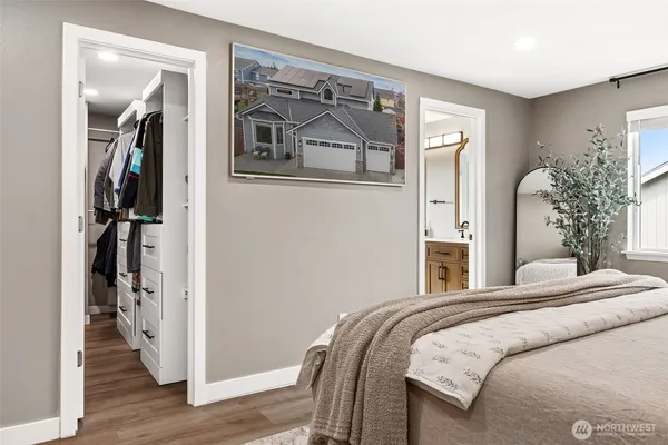 a spacious bathroom with a double vanity sink a mirror and shower