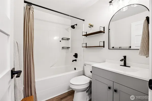 a bedroom with a bed and a dresser