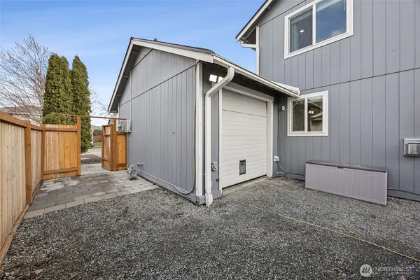 an aerial view of a house with garden space and street view