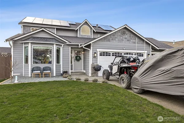 an aerial view of a house with a yard