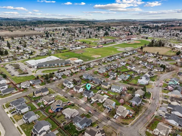 an aerial view of residential houses with outdoor space