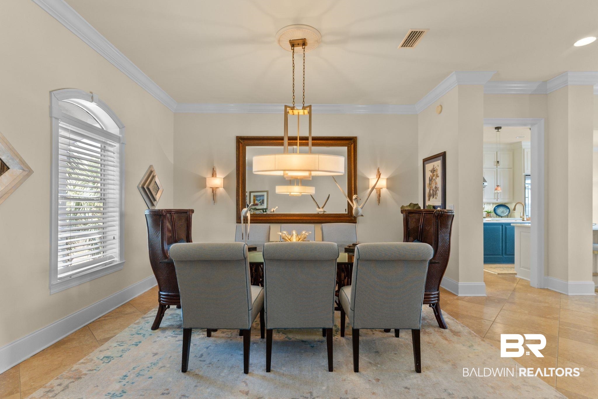 30818 River Road Orange Beach, AL 36561 - Photo 16 of 81 Dining area featuring ornamental molding and light tile patterned floors