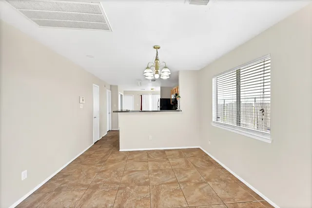 a kitchen with stainless steel appliances granite countertop a stove and a sink