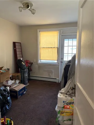 a room with furniture and musical instruments