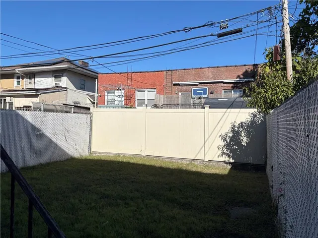 a view of a backyard of the house