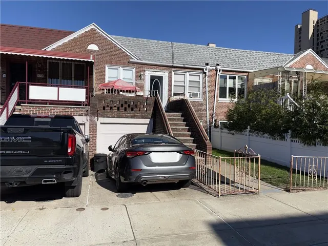 a car parked in front of house with a car parked