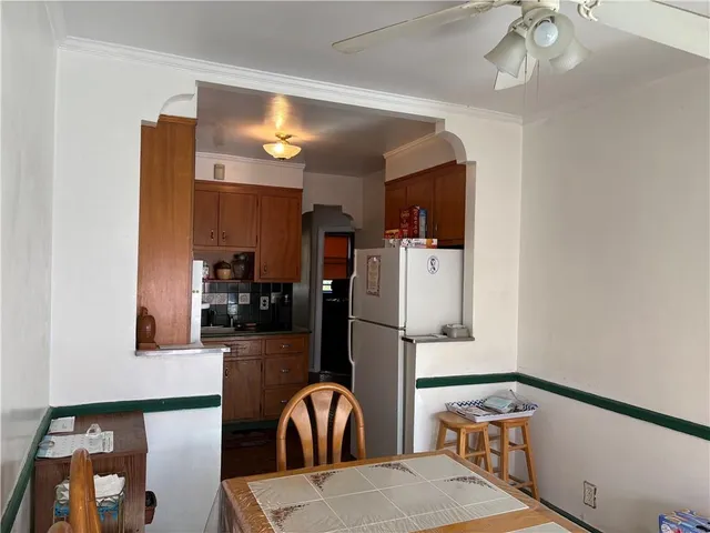 a kitchen with stainless steel appliances refrigerator stove microwave and cabinets