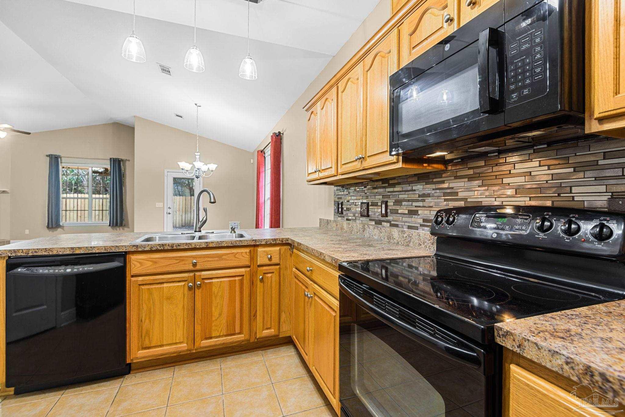 1007 Patriot Place Pensacola, FL 32534 - Photo 19 of 40 a kitchen with a stove and a sink