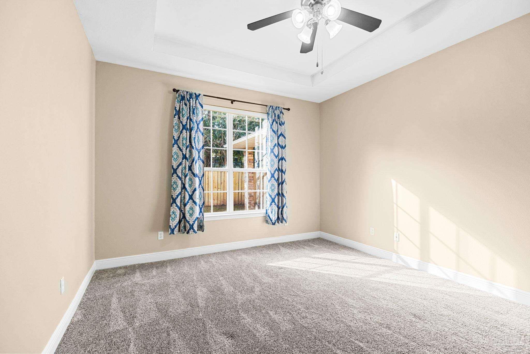 1007 Patriot Place Pensacola, FL 32534 - Photo 22 of 40 an empty room with windows and ceiling fan