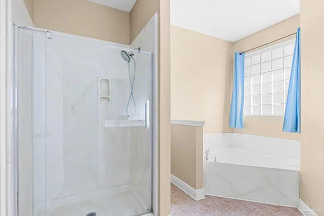 a bathroom with a shower and a tub