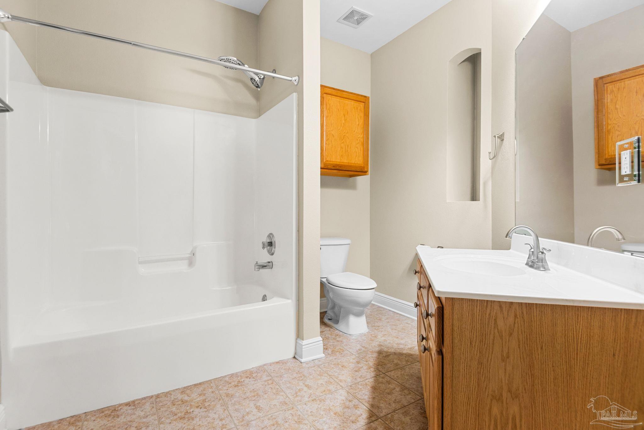 1007 Patriot Place Pensacola, FL 32534 - Photo 32 of 40 a bathroom with a sink toilet and shower