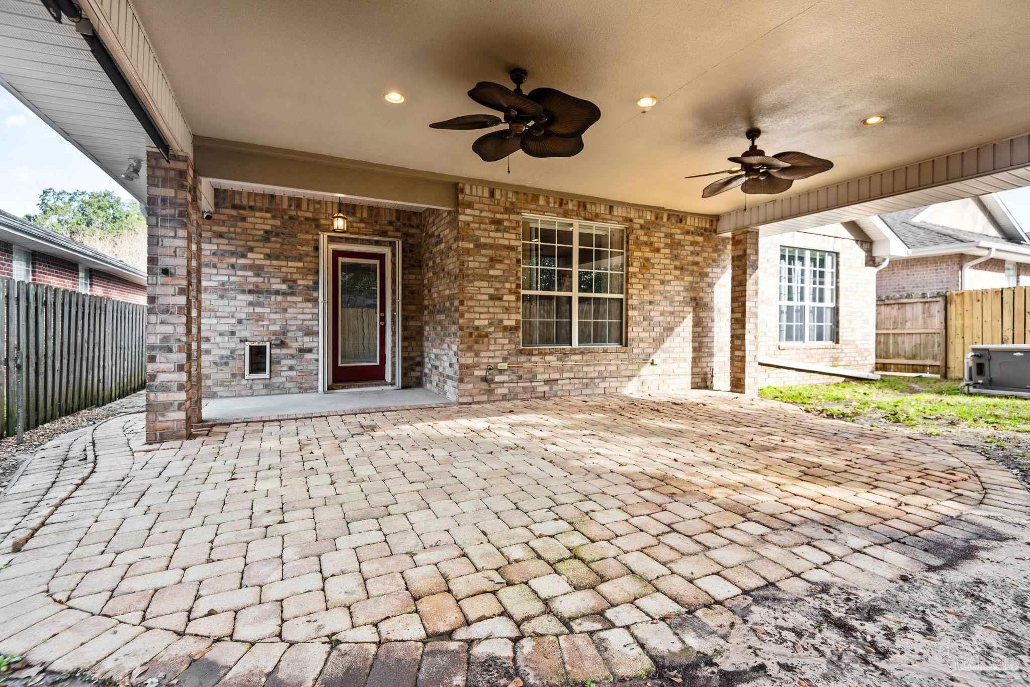 1007 Patriot Place Pensacola, FL 32534 - Photo 37 of 40 a view of a flesh screen tv and wooden floor