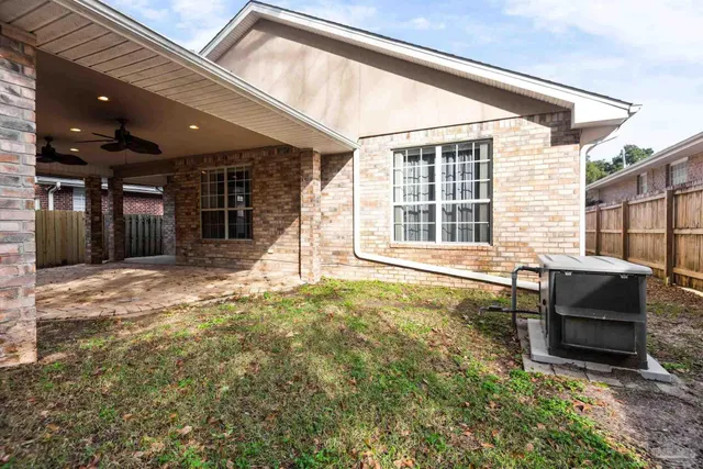a backyard of a house with seating space