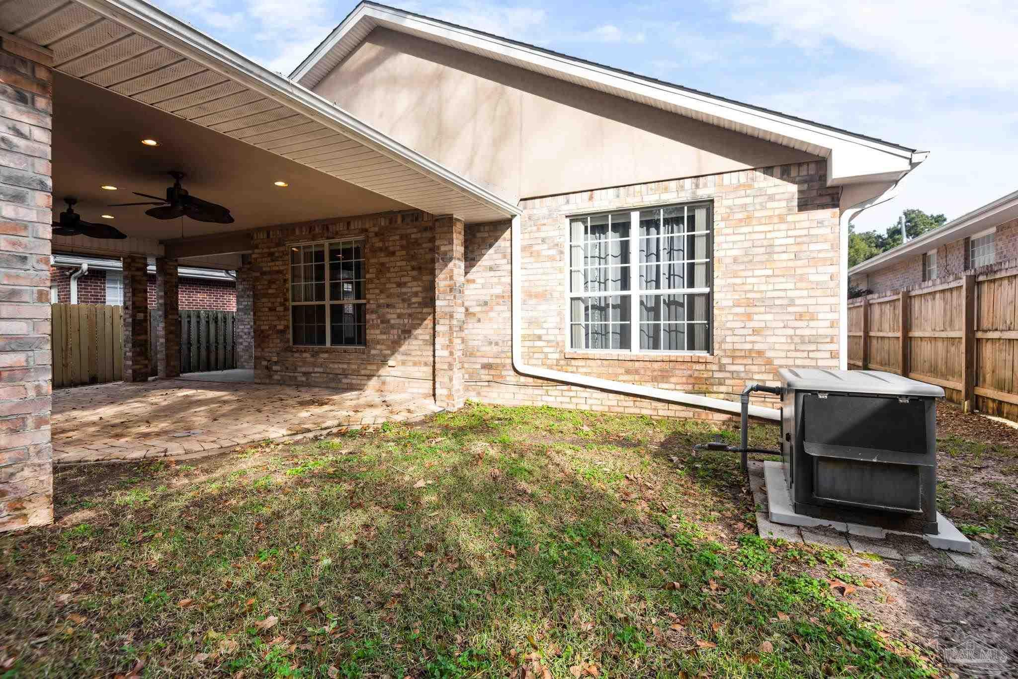 1007 Patriot Place Pensacola, FL 32534 - Photo 38 of 40 a backyard of a house with seating space