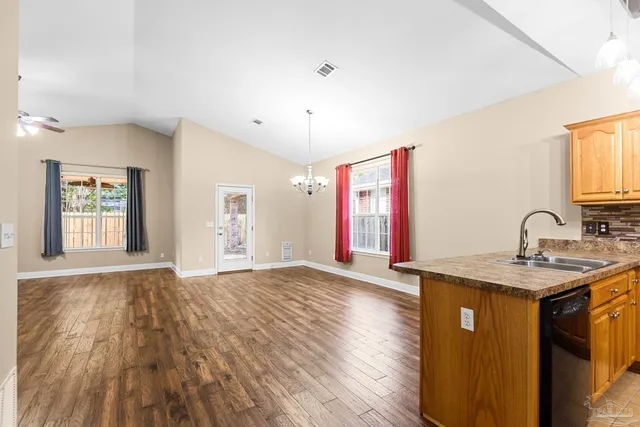 a view of a kitchen with a sink and a window
