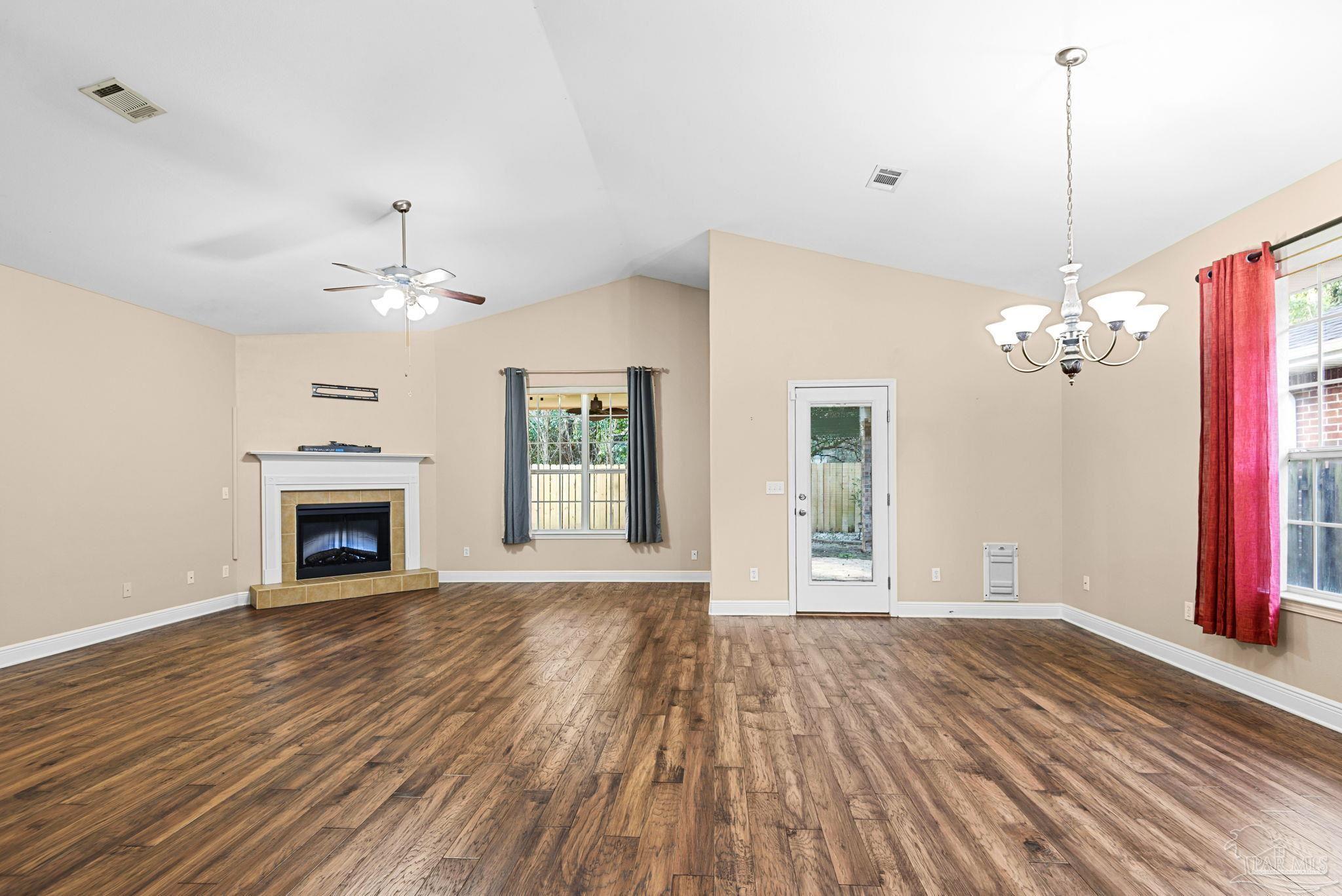 1007 Patriot Place Pensacola, FL 32534 - Photo 7 of 40 a view of an empty room with a fireplace and chandelier