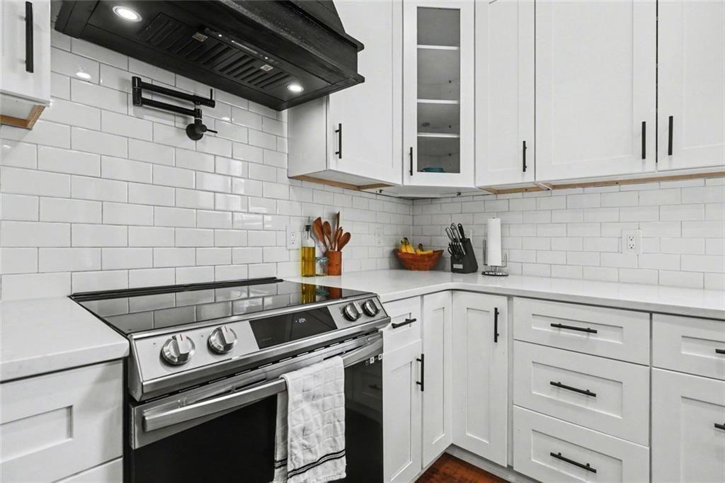 417 Pennington Avenue Southwest Rome, GA 30161 - Photo 11 of 30 a stove top oven sitting inside of a kitchen