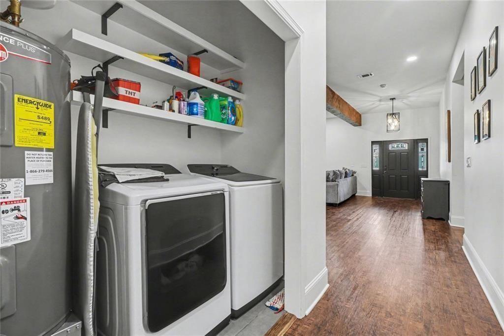 417 Pennington Avenue Southwest Rome, GA 30161 - Photo 12 of 30 a utility room with dryer washer and a view of living room