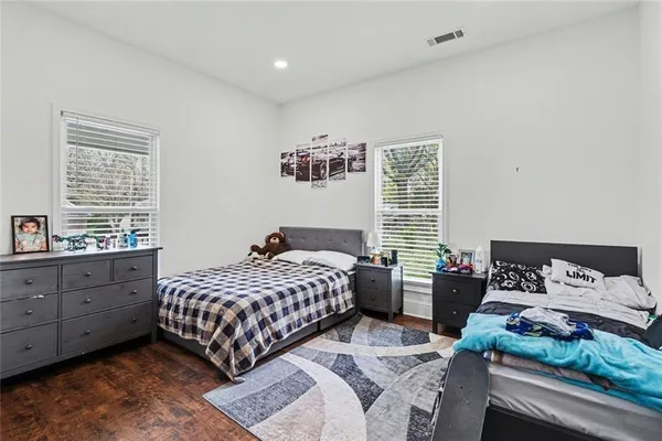 a bedroom with a bed and a book shelf
