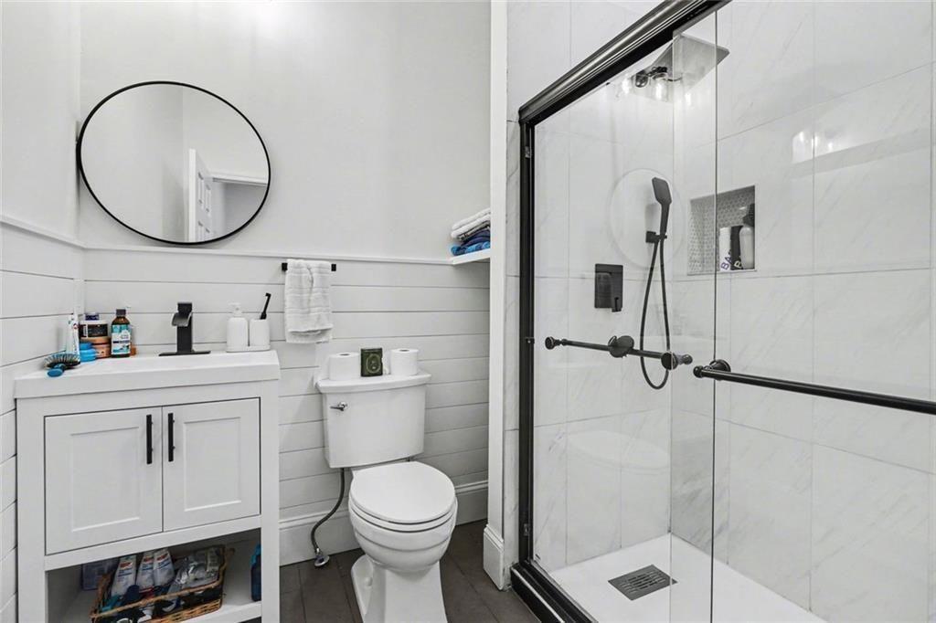 417 Pennington Avenue Southwest Rome, GA 30161 - Photo 15 of 30 a bathroom with a sink a toilet and a mirror