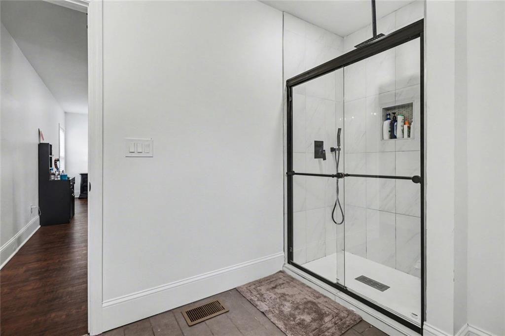 417 Pennington Avenue Southwest Rome, GA 30161 - Photo 24 of 30 a bathroom with a glass shower door