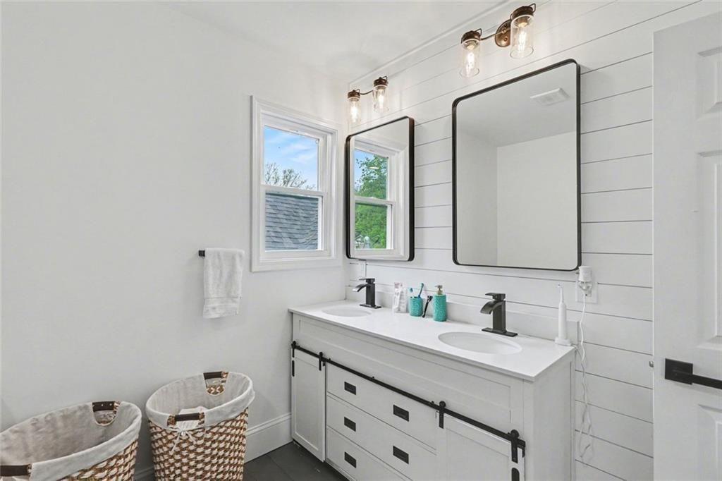 417 Pennington Avenue Southwest Rome, GA 30161 - Photo 26 of 30 a bathroom with a sink toilet vanity and mirror