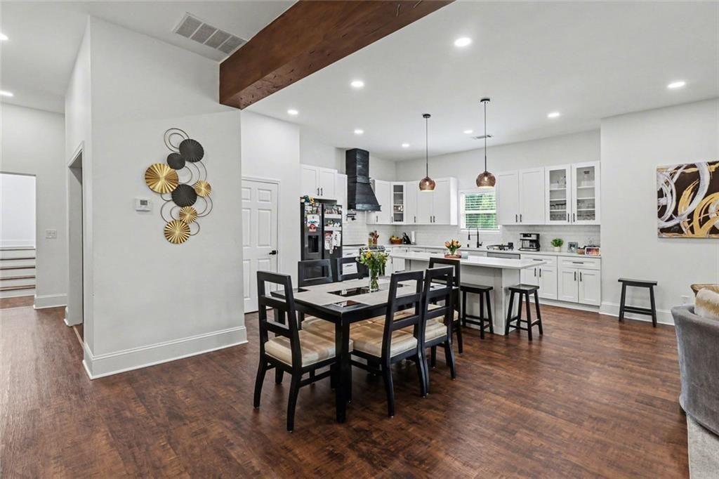 417 Pennington Avenue Southwest Rome, GA 30161 - Photo 7 of 30 a dining room with stainless steel appliances kitchen island granite countertop a dining table chairs and view living room