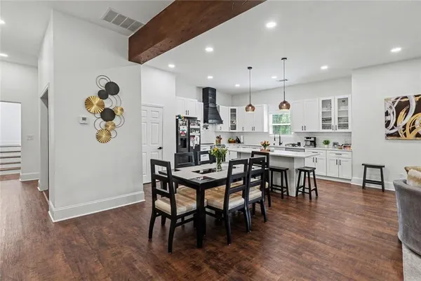 a kitchen with stainless steel appliances kitchen island a large island in the center