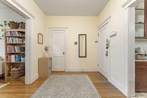 a bedroom with a bed table and window
